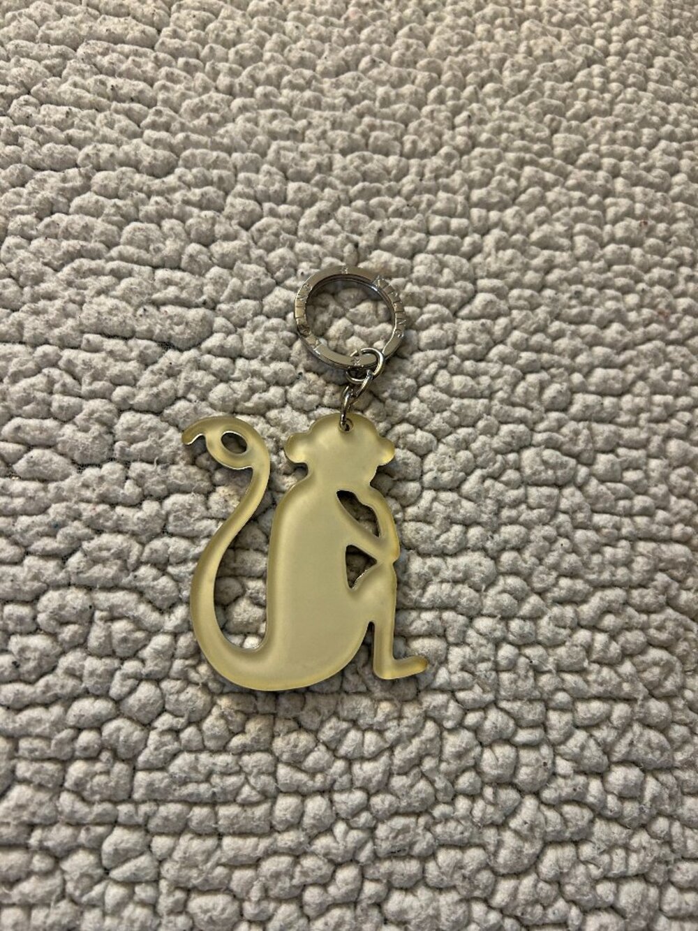Kipling -- cream acrylic keychain